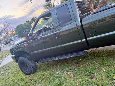 1999 Ford E350 Super Duty Passenger - Cabina y media