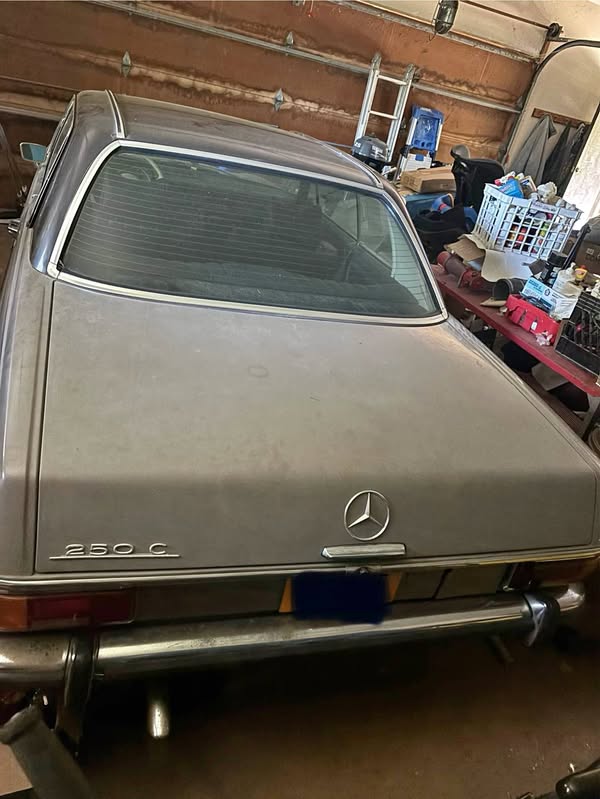 This is a 1971 Mercedes-Benz 250C coupe featuring classic W114 body styling