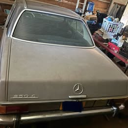 This is a 1971 Mercedes-Benz 250C coupe featuring classic W114 body styling