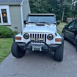 2004-4.0 6cyl Jeep Wrangler with 5 oversized tires,  AS IS