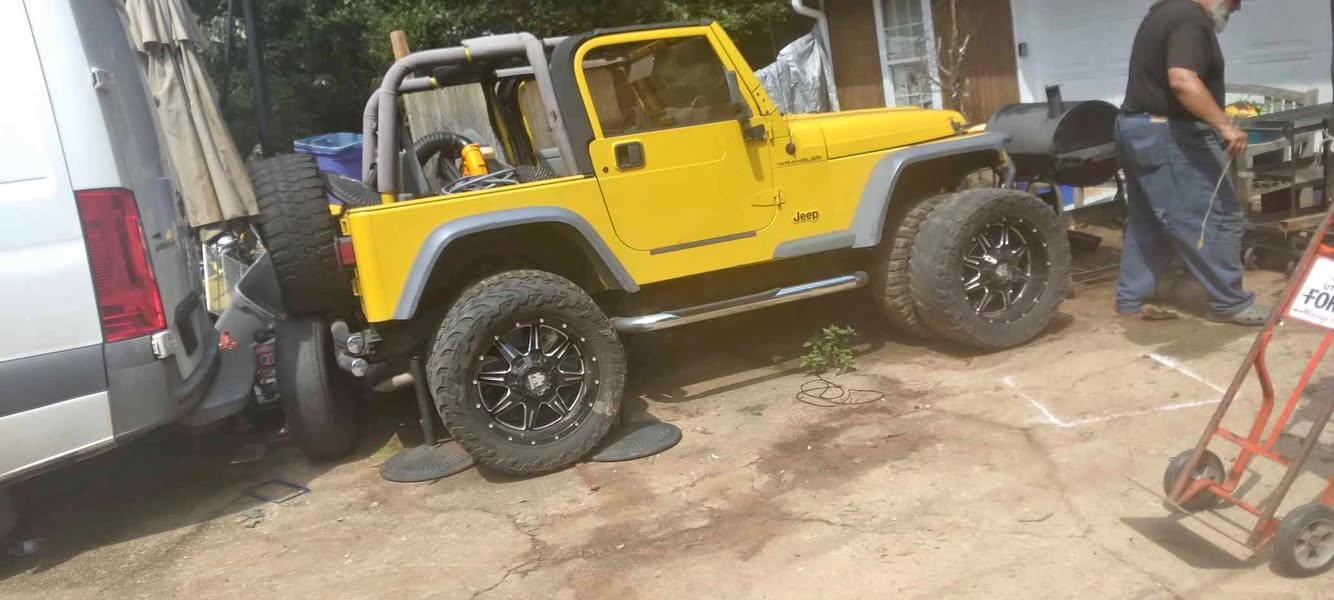 2002 Jeep Wrangler 120,000 MI 4 cylinder great motor and transmission paid $5, 000 to get it lifted